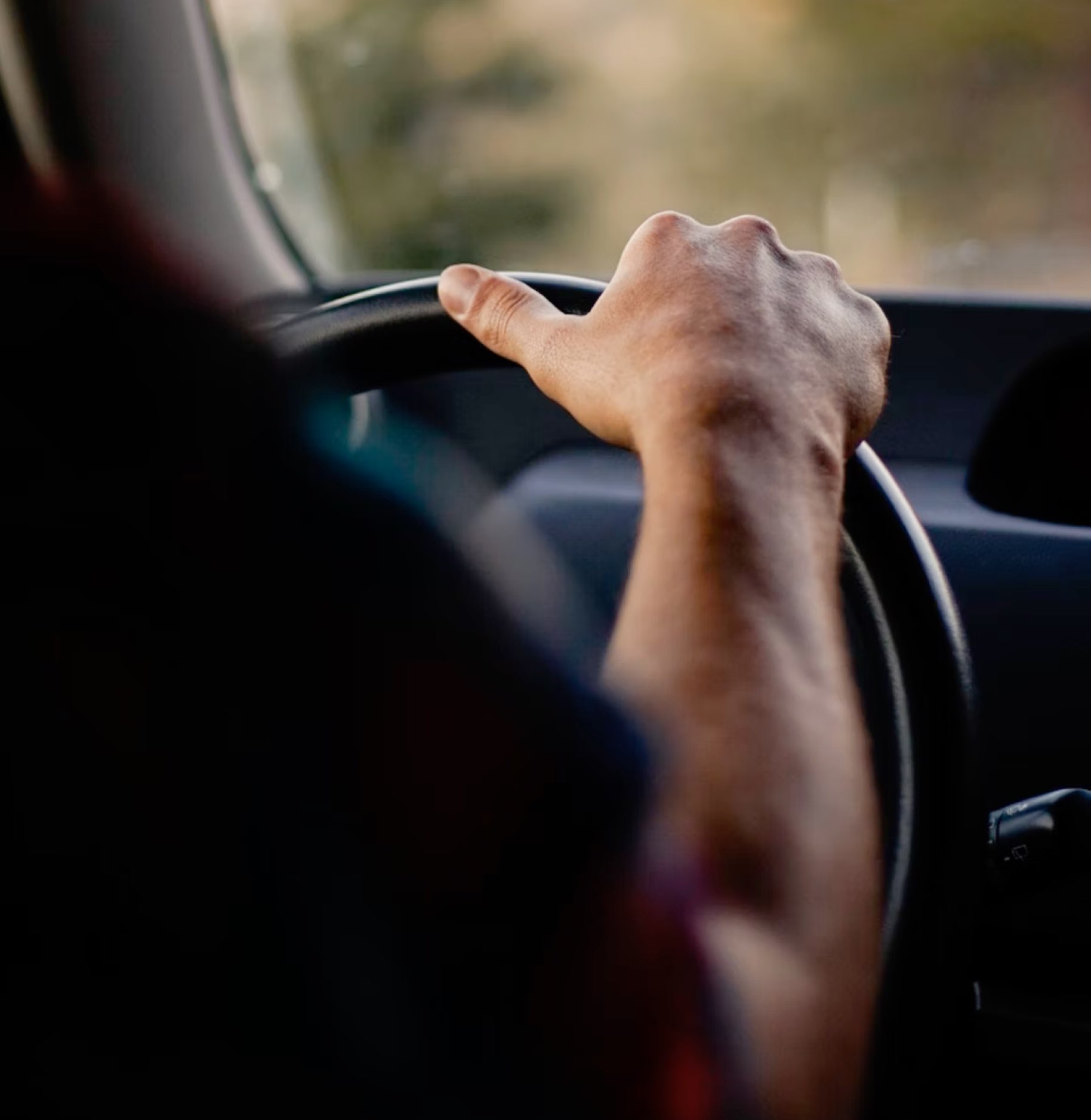 man driving a car